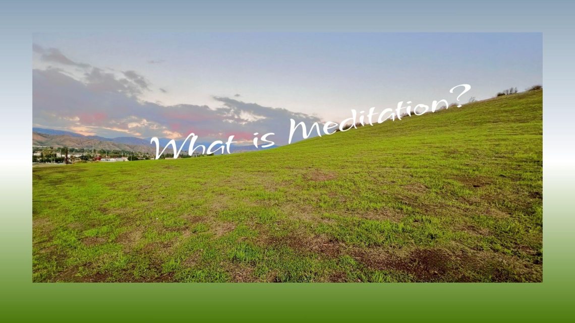 A wide green hillside under a soft evening sky with distant mountains and clouds. The text overlay reads, “What is Meditation?”