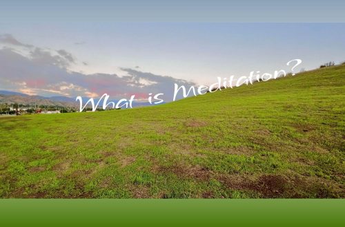 A wide green hillside under a soft evening sky with distant mountains and clouds. The text overlay reads, “What is Meditation?”