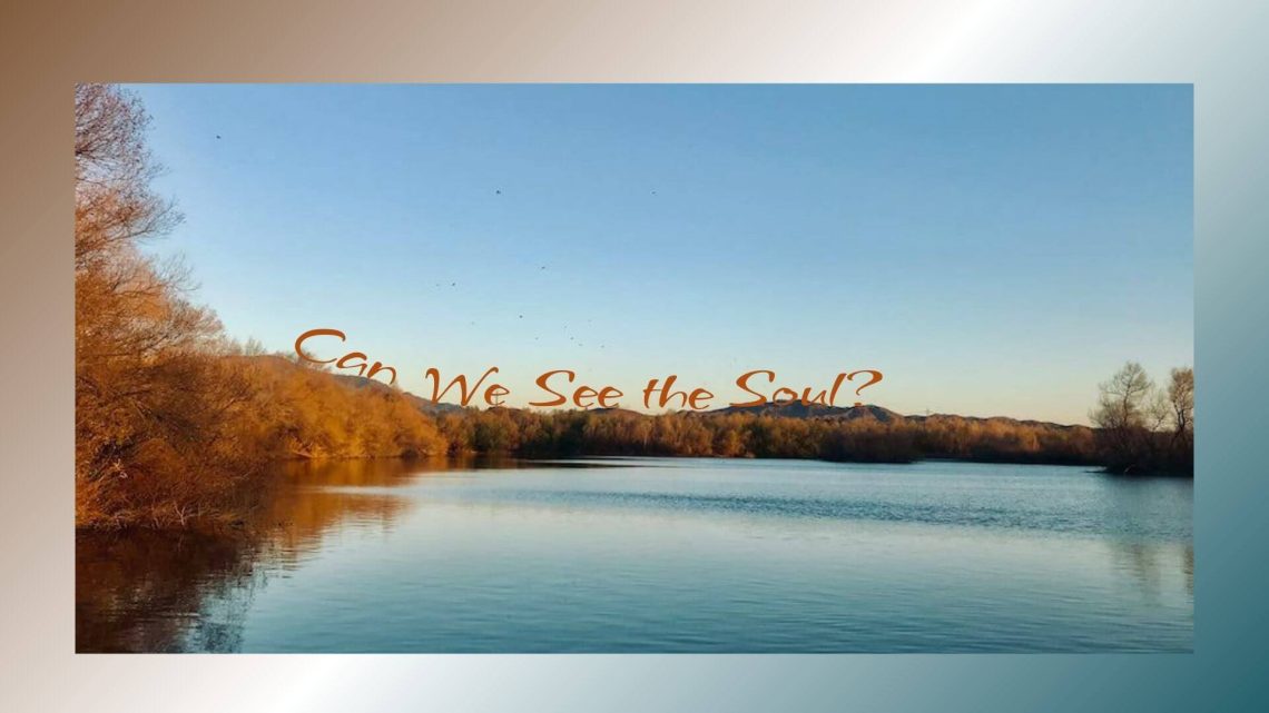 A calm river reflecting the clear blue sky, surrounded by autumn-colored trees glowing in golden light. The text across the image reads, “Can We See the Soul?”