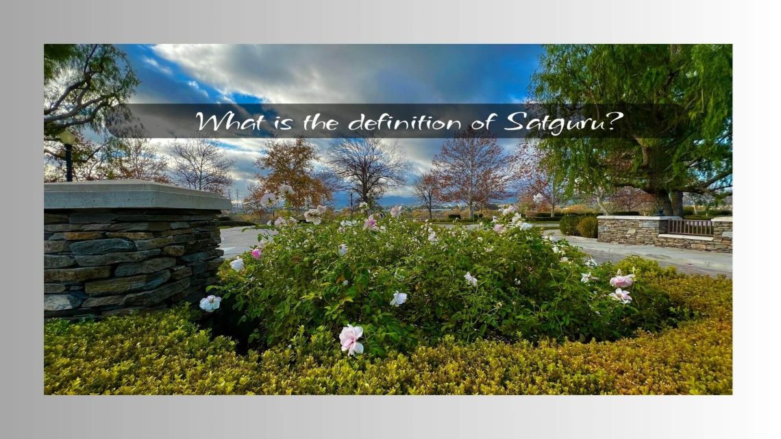 peaceful garden with blooming flowers, stone walls, and trees under a dramatic, cloudy sky. The text overlay reads, “What is the definition of Satguru?”