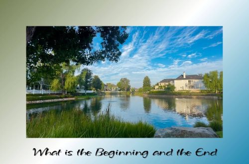 A calm lake reflecting houses, trees, and a blue sky with soft white clouds, framed by greenery and a quiet atmosphere of stillness.