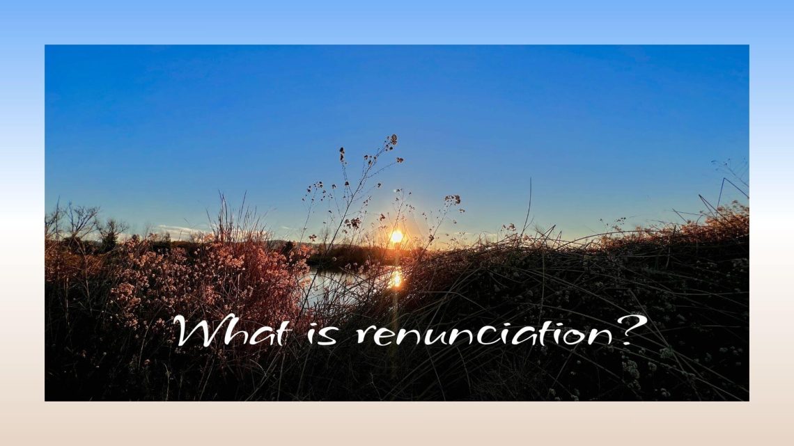 A golden sunset shining through tall grasses and wildflowers, casting warm light on the landscape under a clear blue sky. The text on the image reads, “What is renunciation?”