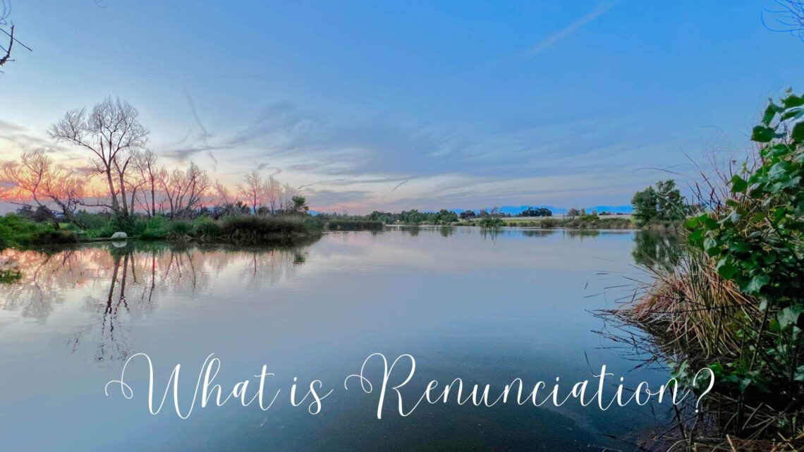 what is renunciation words are written on a image of a lake at sunset.