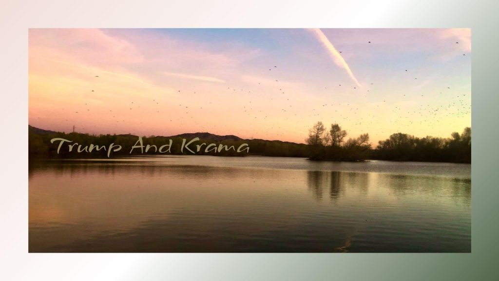 A calm lake reflecting the soft colors of a pastel sunset with trees and mountains in the background. The sky is filled with birds flying, and the text on the image reads, “Trump And Krama.”