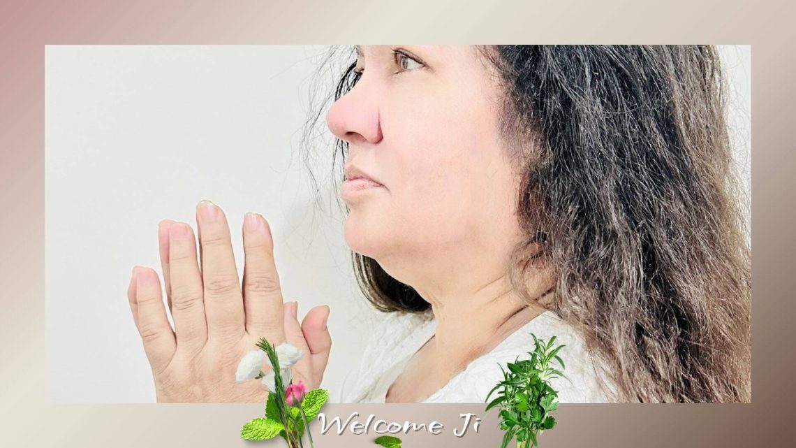A serene portrait of Shaheer Sehyogi in prayerful silence with folded hands, symbolizing welcome, peace, and meditative presence.